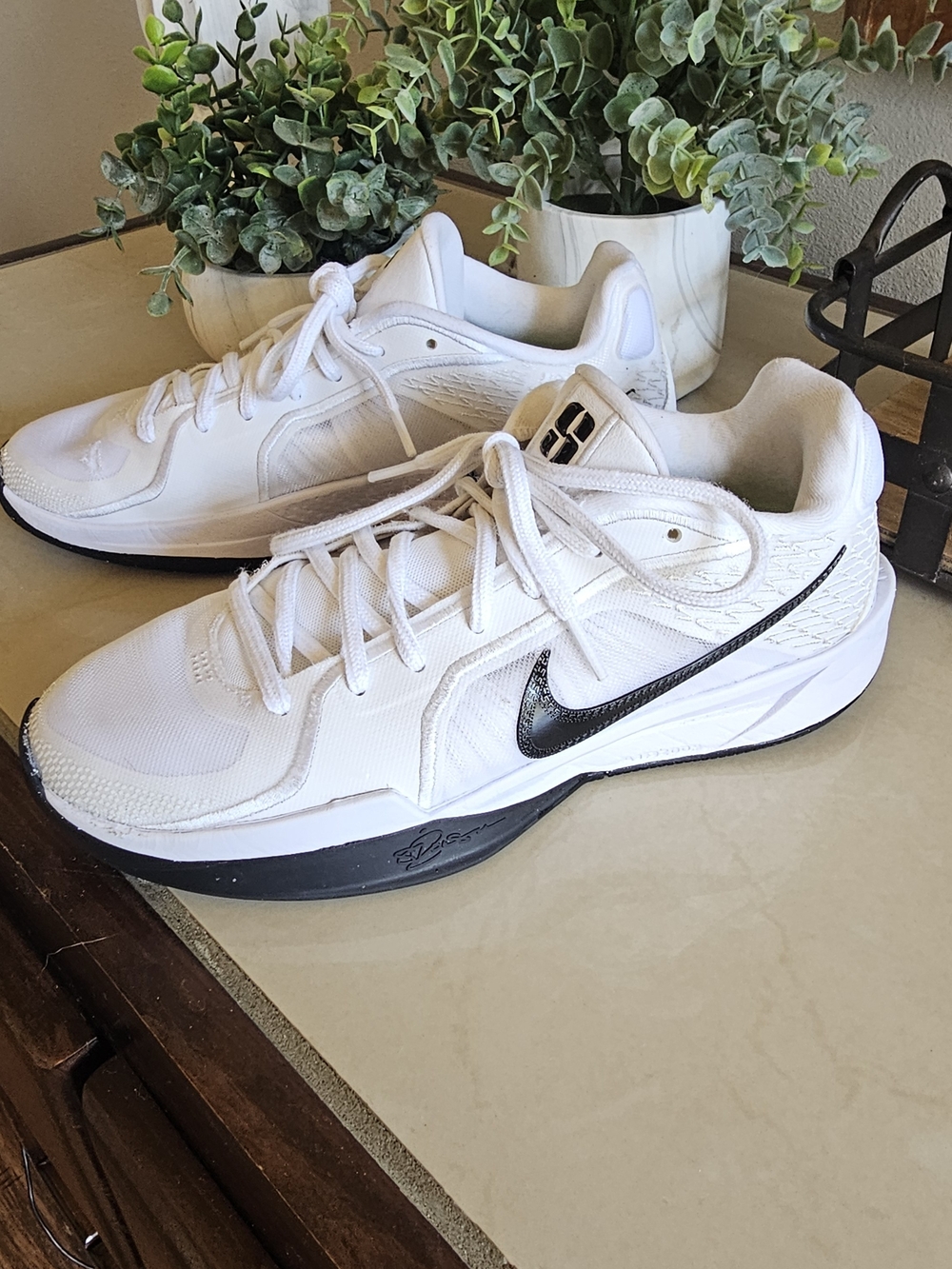Nike women's White Low-Top Tennis Basketball Sneakers with Black Swoosh